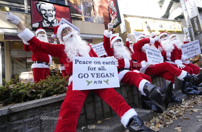11184222 - Animal rights activists of People for the Ethical Treatment of  Animals (PETA) protest in front of a KFC fast food restaurantSearch | EPA